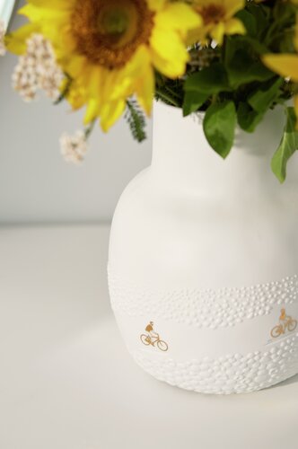 Vase Fahrt durchs Blumenfeld Räder