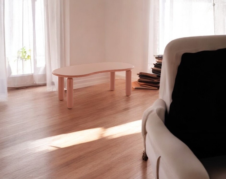 Undique Mas Couchtisch von Kartell in Puderrosa, modernes Design mit abgerundeter Tischplatte und zylindrischen Beinen.