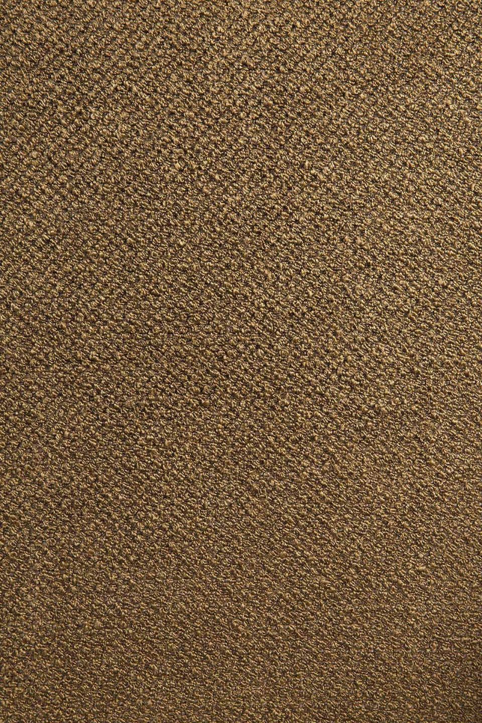 Detailaufnahme des Stoffes vom Ethnicraft Barrow Sitzhocker in Ingwer. Texturierter, brauner Hockerstoff für Wohnzimmer und mehr.