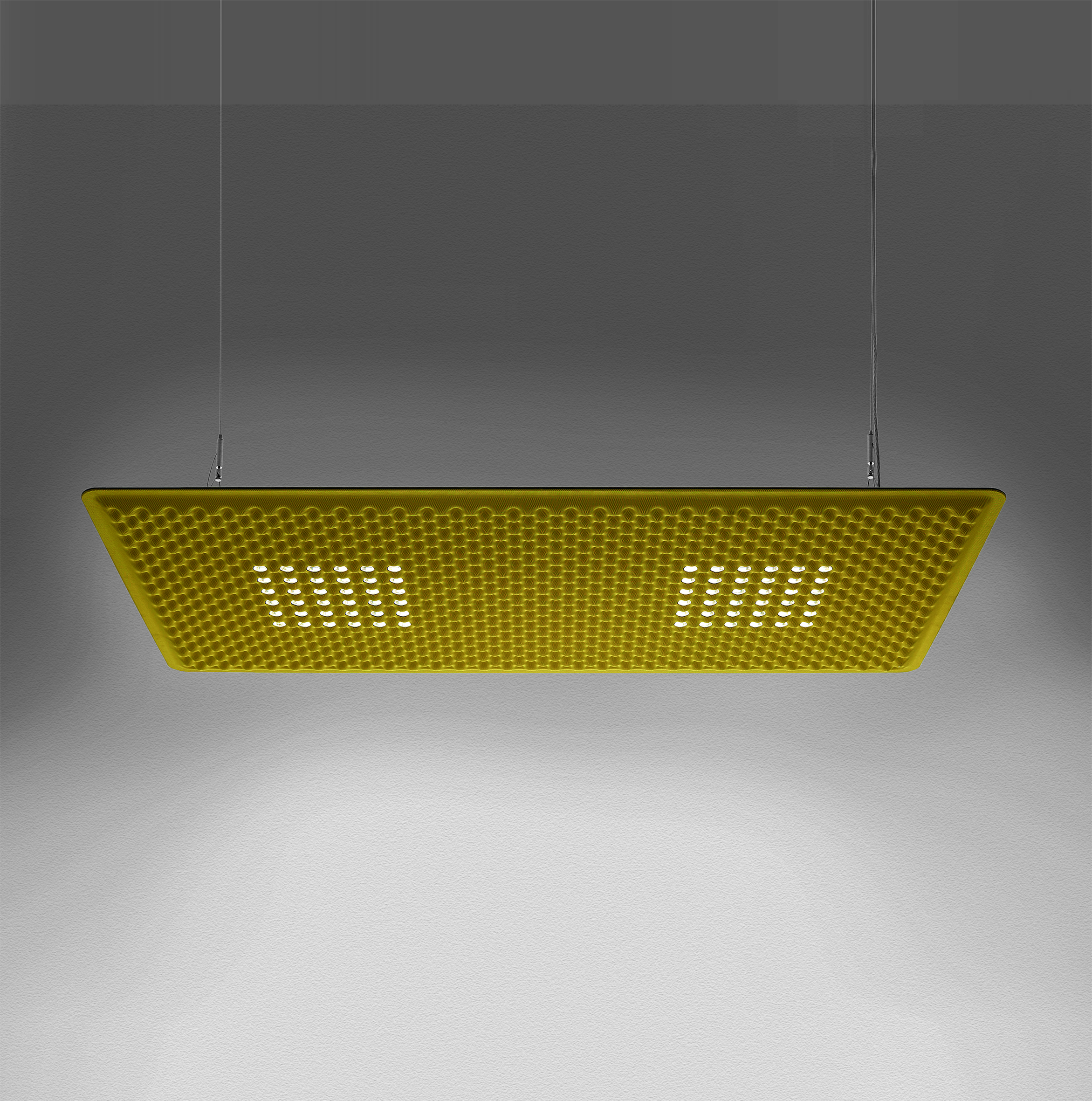 Gelbe Eggboard Matrix Pendelleuchte von Artemide mit Wabenstruktur und LED-Beleuchtung vor grauem Hintergrund.