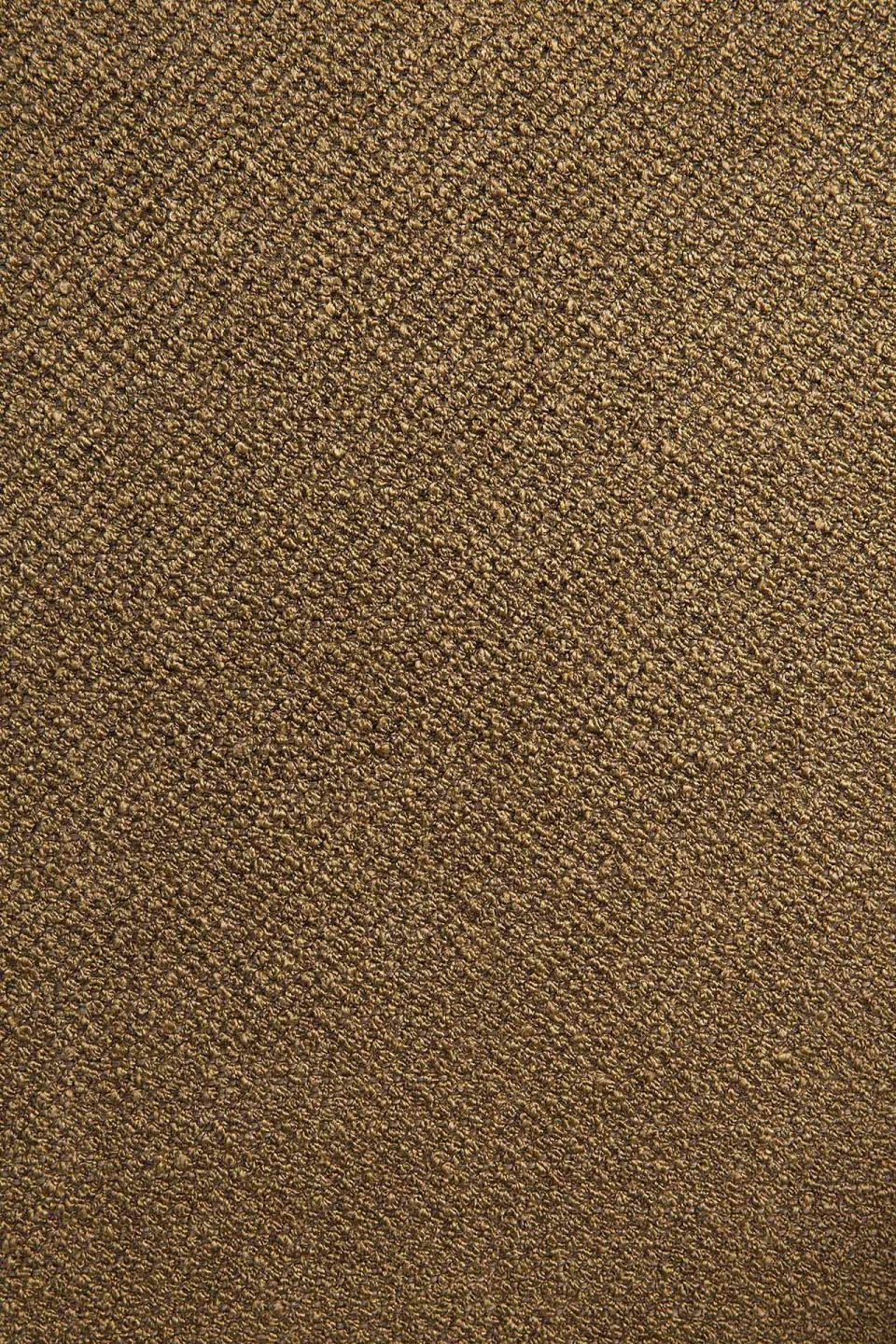 Detailaufnahme des Stoffes vom Ethnicraft Barrow Sitzhocker in Ingwer. Texturierter, brauner Hockerstoff für Wohnzimmer und mehr.