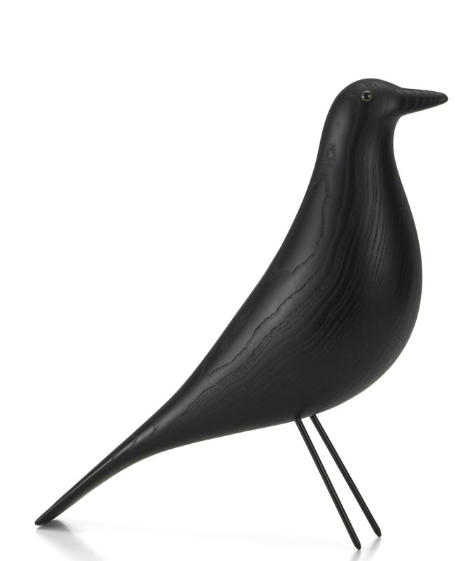Eames House Bird von Vitra, eine dekorative Vogelskulptur aus schwarzem Eschenholz auf filigranem Drahtgestell.